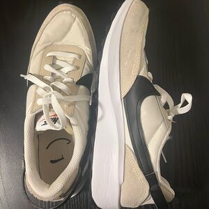 Nike Woman’s Beige and Black Sneakers